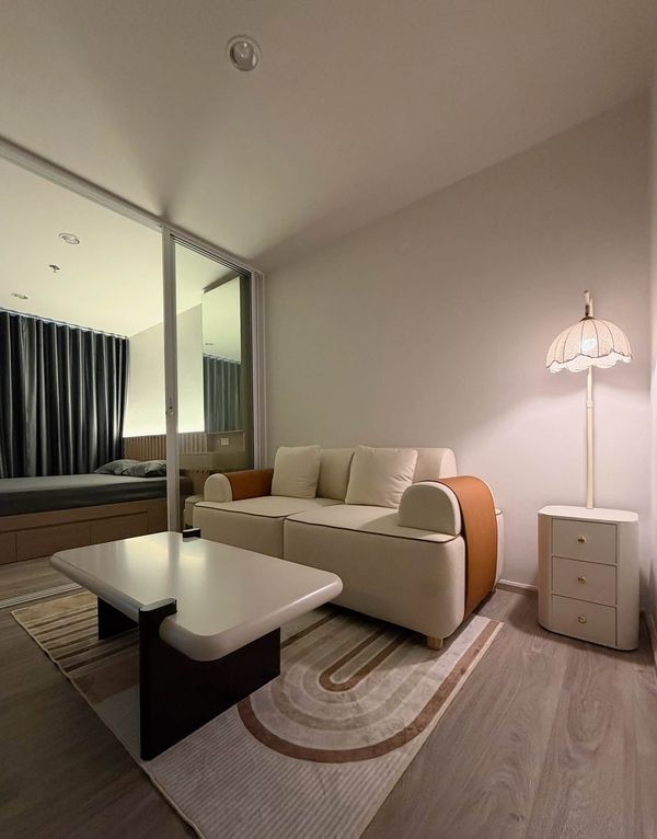 Regent Home Bangna , Near BTS Bangna.  A cozy, warm-toned condo with built-in furniture and an open view, offering a comfortable space to relax and unwind every day.